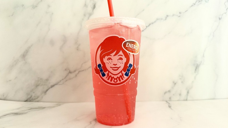 Wendy's Watermelon Sparkling Energy in cup on marble surface