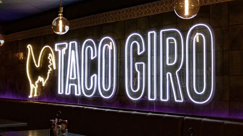 A neon Taco Giro sign