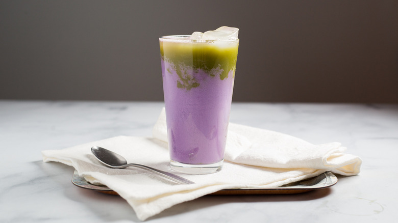 tall purple drink on table