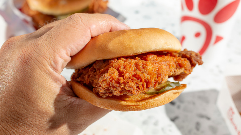 Hand holding Chick-fil-A Original Chicken Sandwich