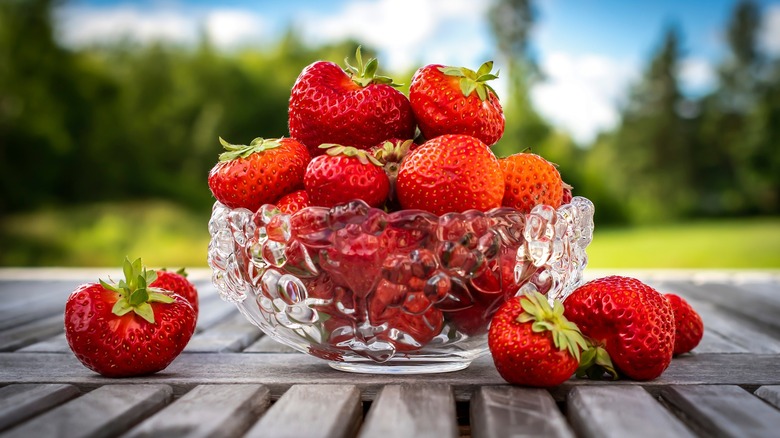 clear bowl of strawberries
