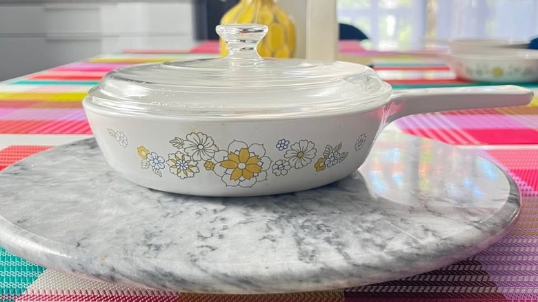 Blue and yellow floral CorningWare dish on a countertop