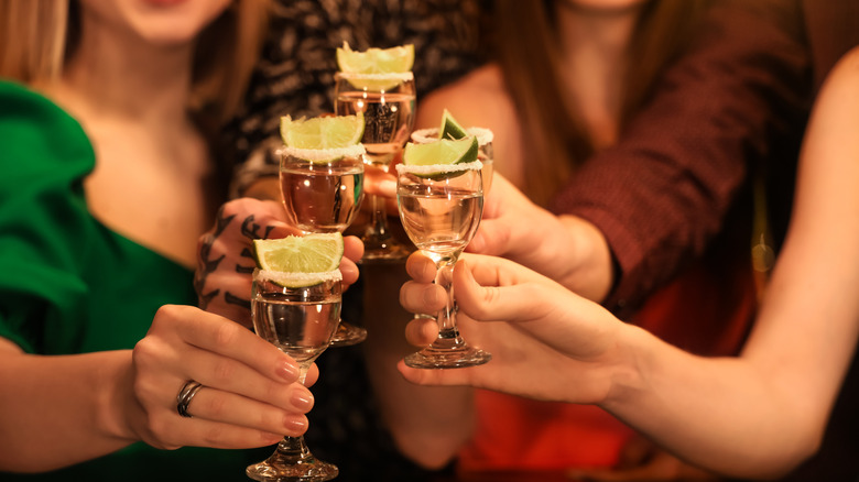 Drinking tequila shots in bar