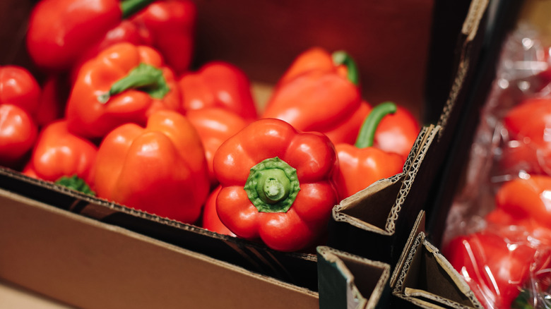 Bell peppers in box at grocery store