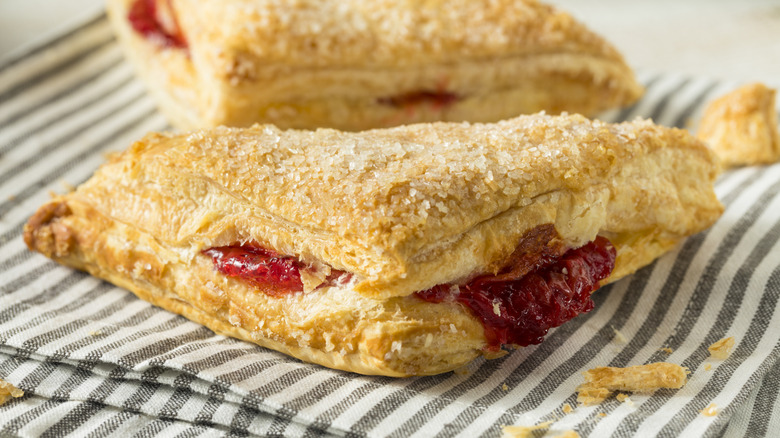 Puff pastry turnovers with cherry filling and a sugar crust