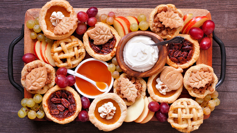 Tray of autumn desserts with pies and fruit