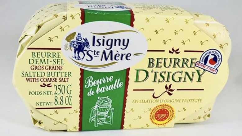 Isigny Ste Mere French butter in packaging against an off-white background.