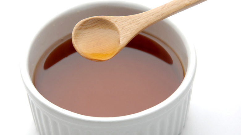 Vinegar scooped up from a ramekin