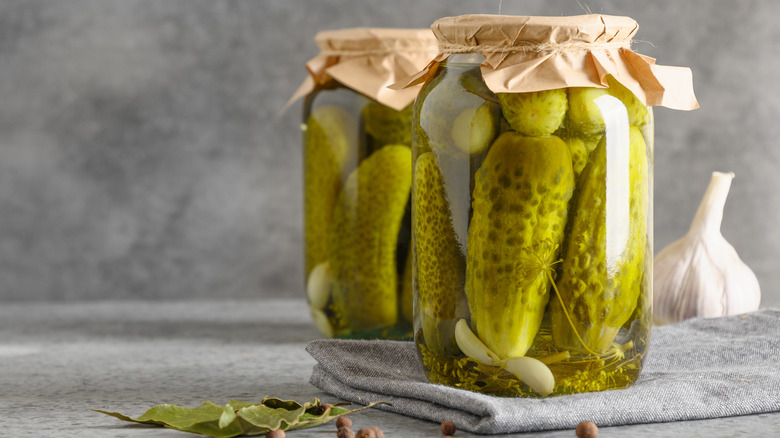 Green pickles in jars