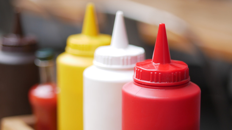 close up of condiment bottles