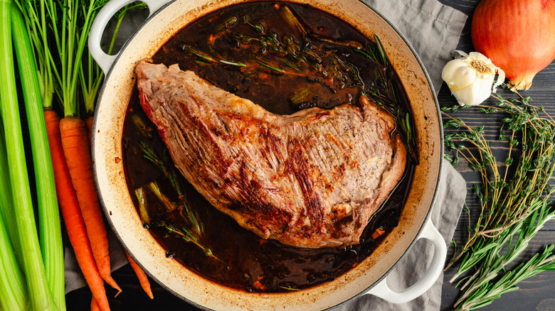 Cut of beef in a pan ready for braising