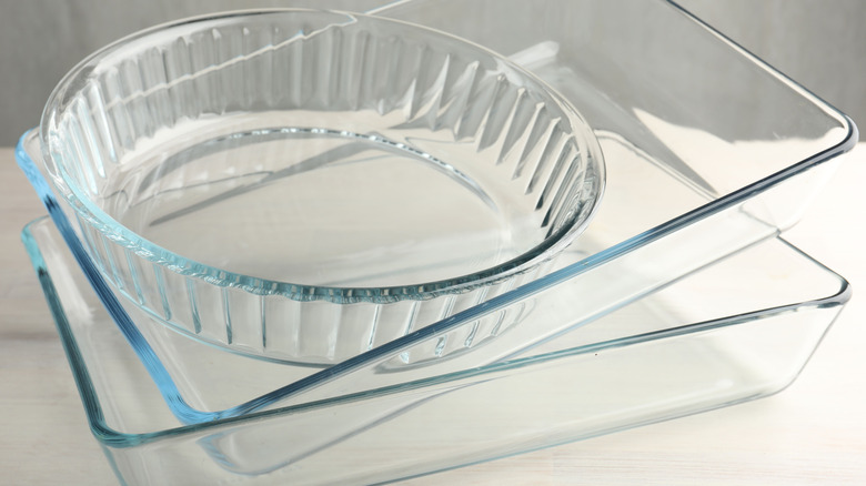 Three clean glass pans stacked on each other.