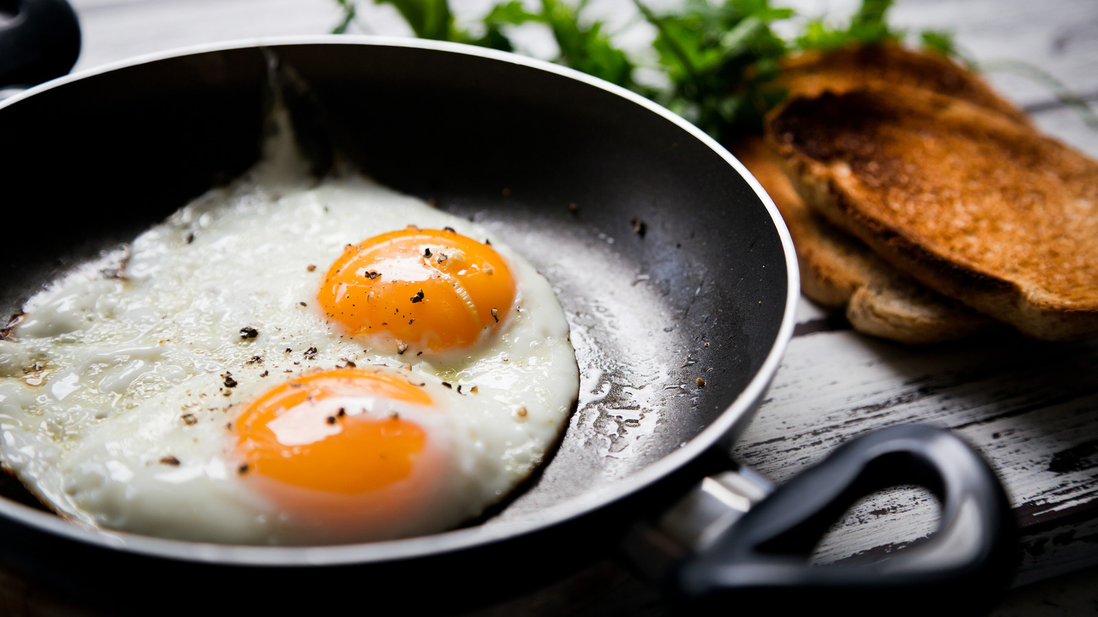 If Your Fried Eggs Aren't Picture-Perfect, It's The Heat - Tasting Table