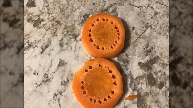 Sliced carrots with holes around the core