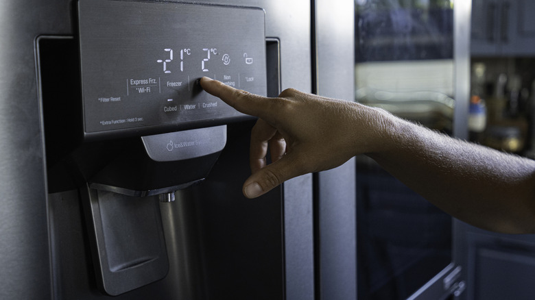 A modern refrigerator with a digital display screen