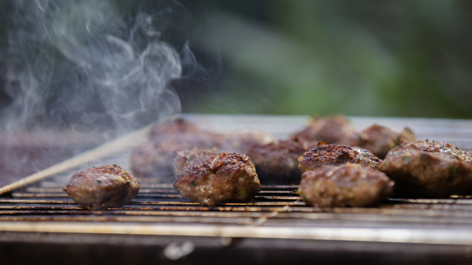 If You're Not Grilling Meatballs, You're Missing Out On This Bold Backyard Flavor