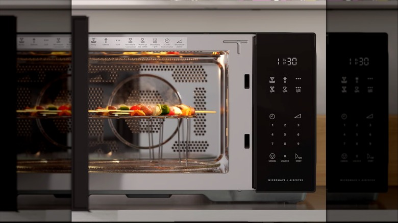 Ikea's GÅTEBO microwave with skewers grilling inside