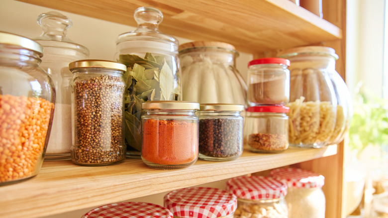 food storage jars in pantry on shelf