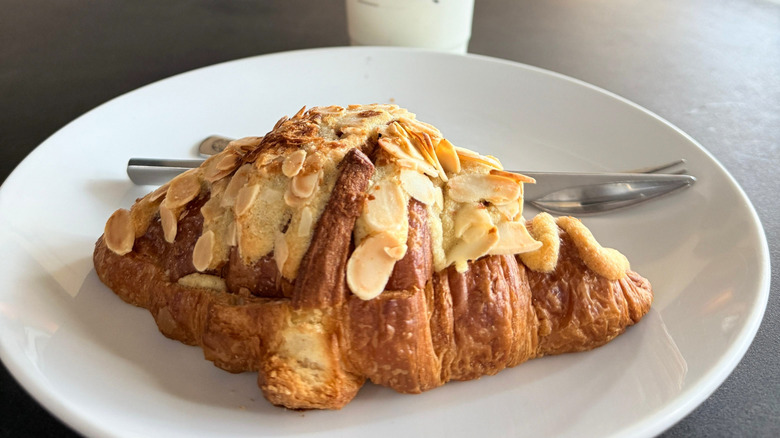 Almond croissant on a white plate