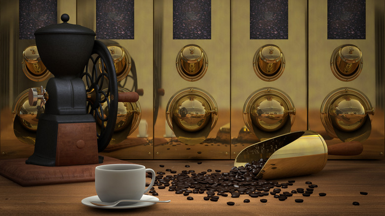 Coffee silos with a white mug and scoop in front