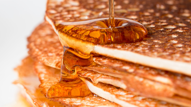 Pancake syrup in containers on a shelf