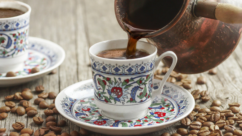 Turkish coffee being poured into cup