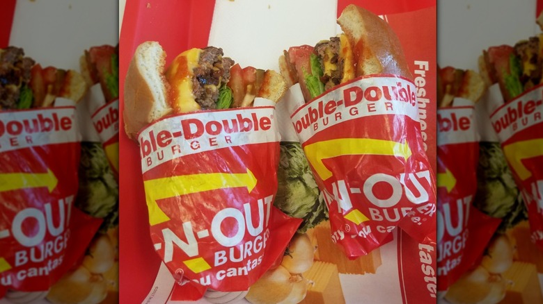 In-N-Out Double Double cut in half on red tray