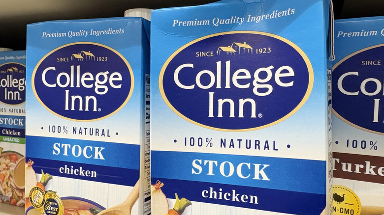 Grocery store display of College Inn brand boxed premade chicken stock