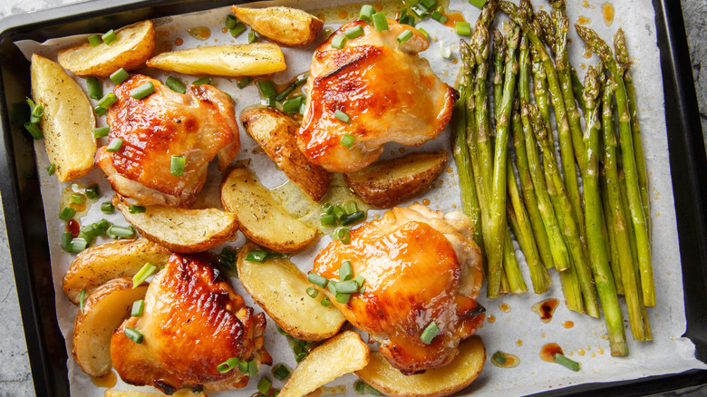 Sheet pan dinner with chicken, potatoes, and veggies