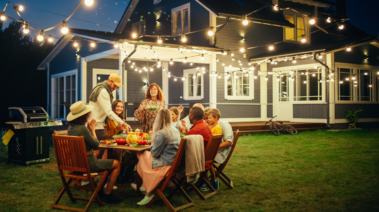 friends laughing at dinner party