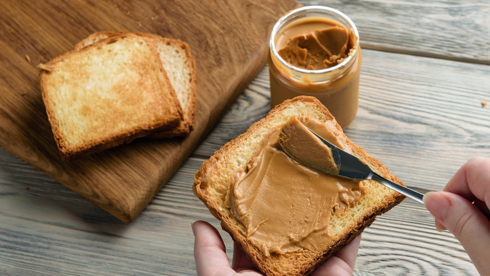 The Gooey Ingredient That Turns Regular Peanut Butter Toast Into A Bakery-Level Treat - Tasting Table