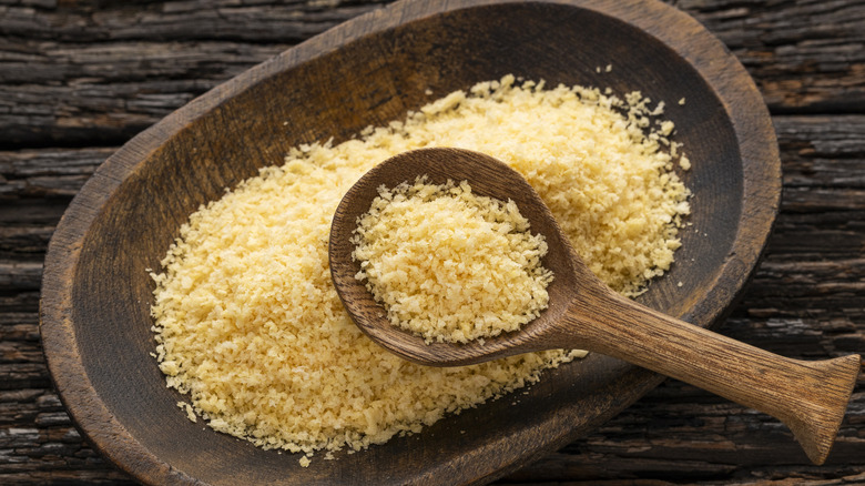 Wooden bowl and spoon filled with panko crumbs
