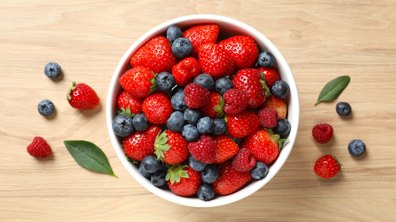 Bowl of fresh strawberries, raspberries, and blueberries