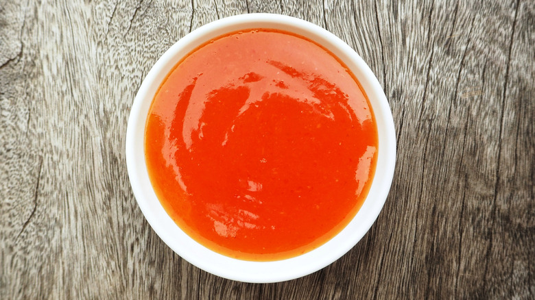 Sriracha sauce in white bowl