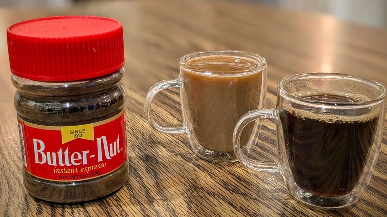 Butter-Nut instant espresso jar and two espresso cups on wood table