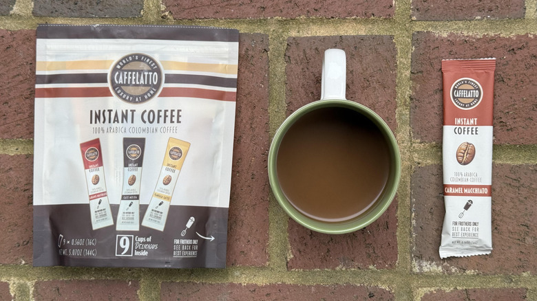 Mug of Caffelato caramel macchiato with packaging and stick