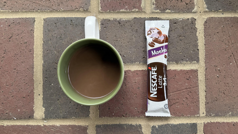 Mug of Nescafé mocha latte with stick