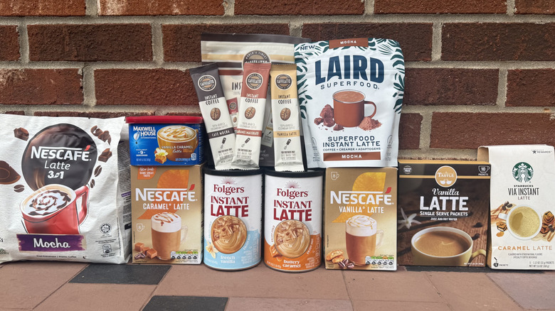 12 instant coffee packages against brick wall