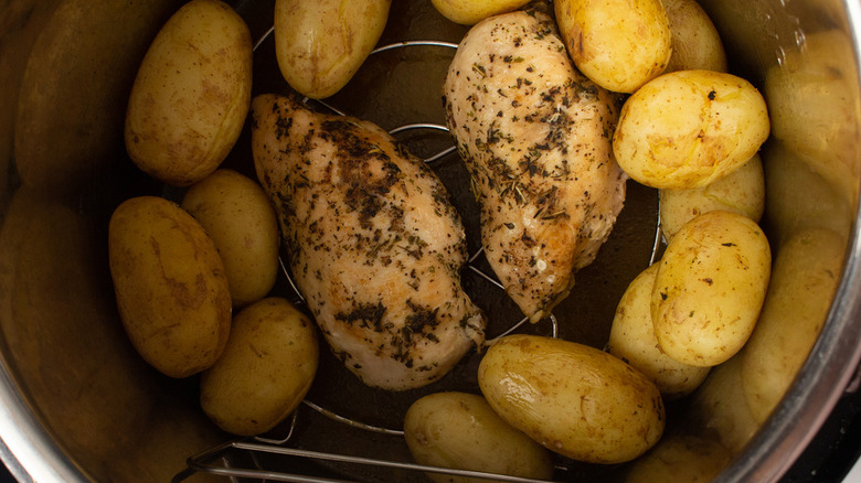 chicken and potatoes in pot