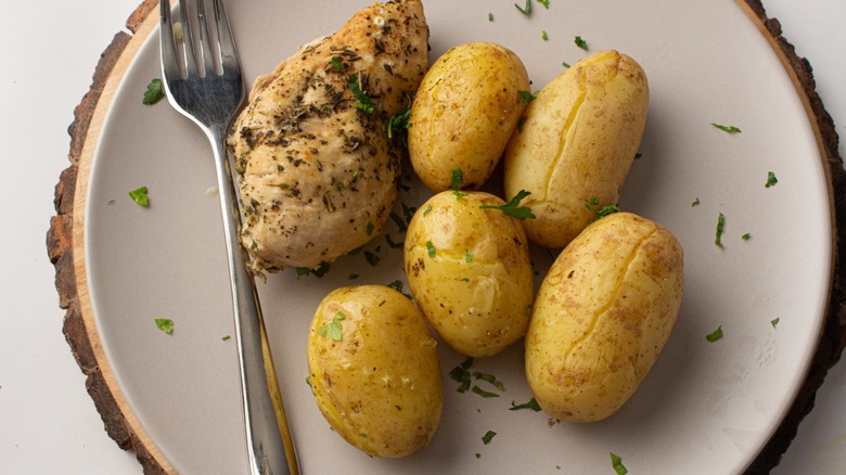 chicken and potatoes on plate