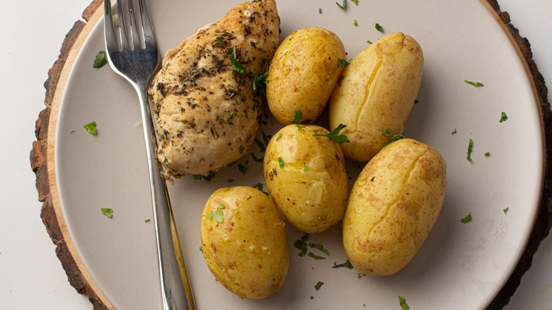 chicken and potatoes on plate