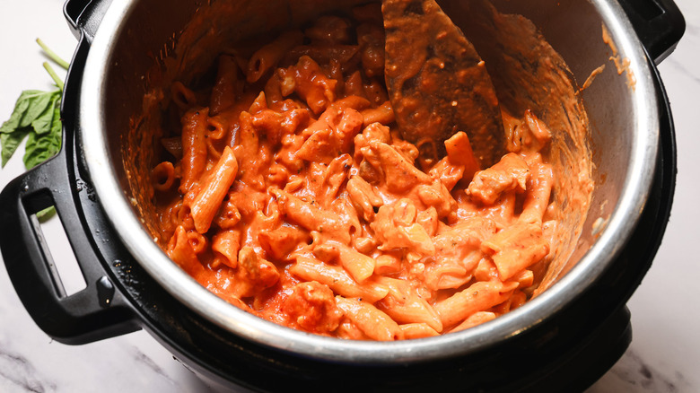 Stirring creamy pasta in Instant Pot