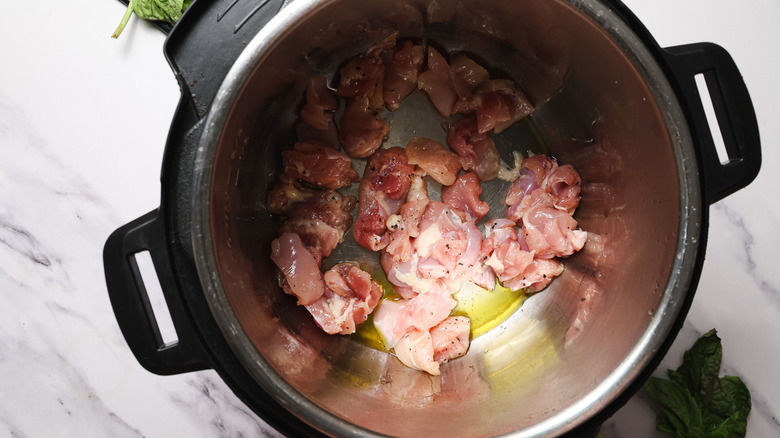 Instant Pot with diced chicken in saute mode