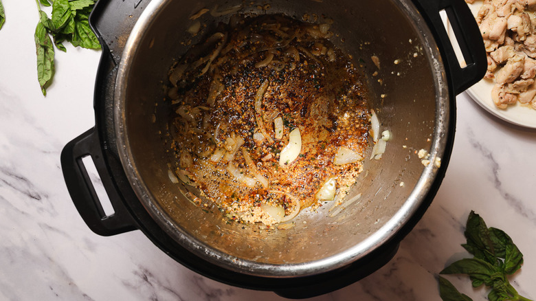 Instant Pot with sauteed and seasoned onion