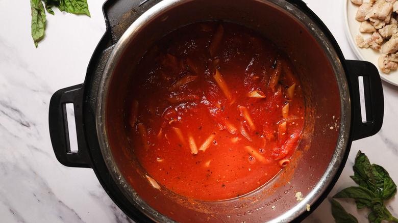 Instant Pot with tomato sauce and pasta