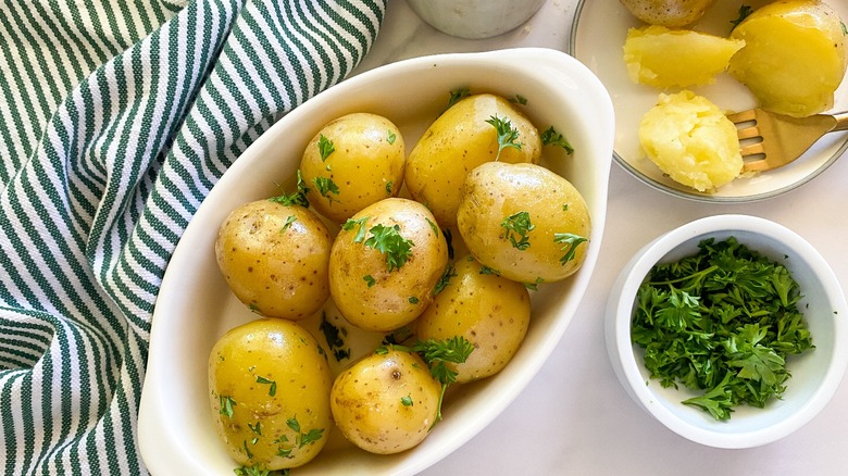 cooked potatoes in white oval dish