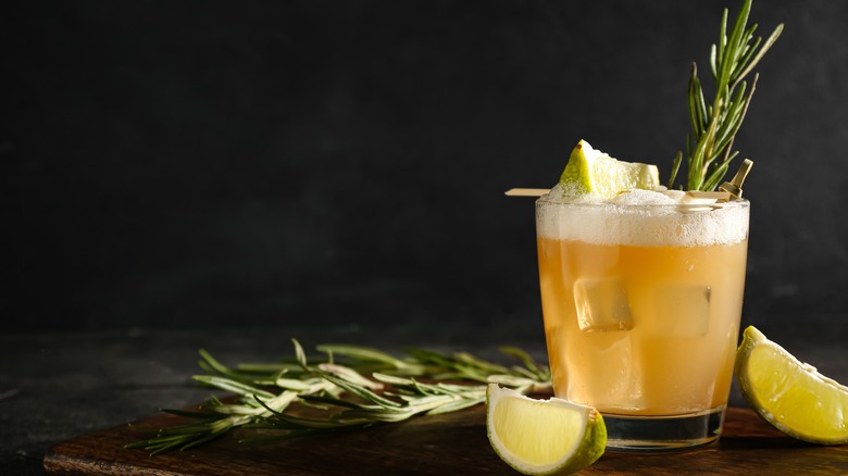 whiskey sour with rosemary garnish