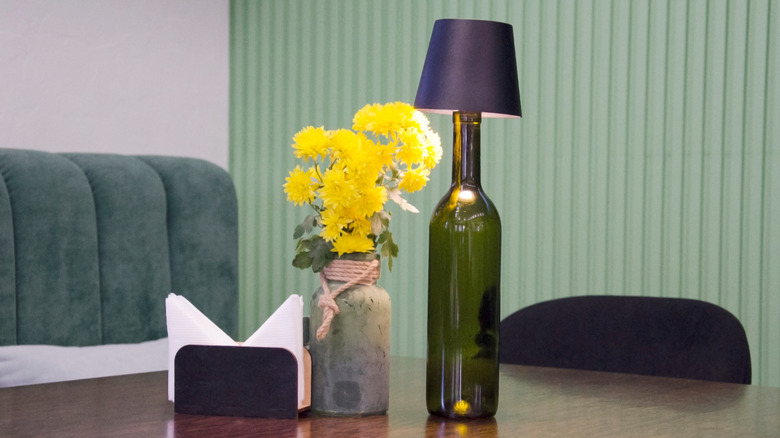 Wine bottle lamp on restaurant table