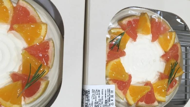 A close-up of two boxes of grapefruit and orange cakes from Costco Korea