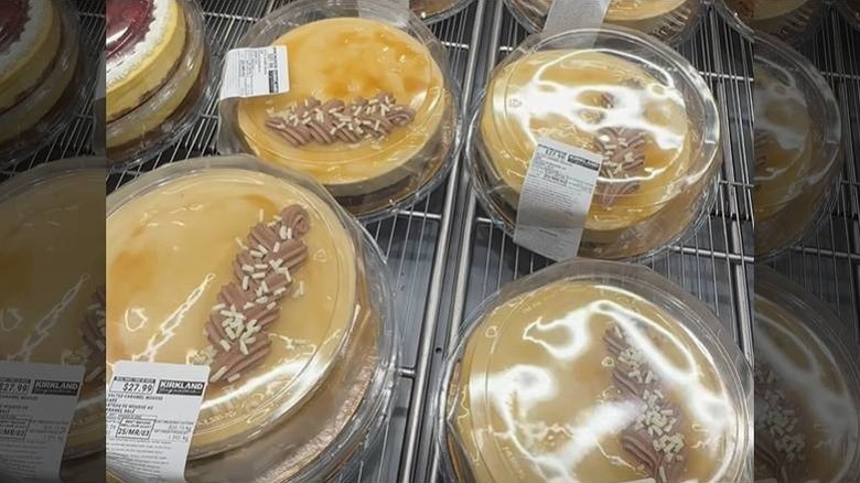 Salted caramel mousse cakes on a rack at a Costco bakery